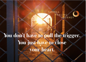 A doorway of light, covered by a metal fence